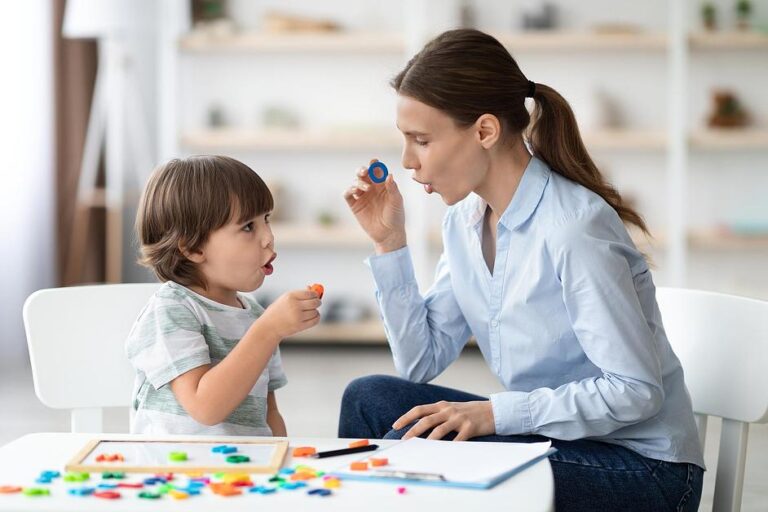 Speech therapy session and iodine enhances cognitive development through interactive letter and sound practice.
