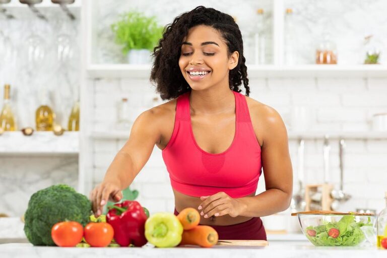 Person in athletic wear preparing colorful vegetables for a healthy immune system boosting meal in kitchen from Zinc.